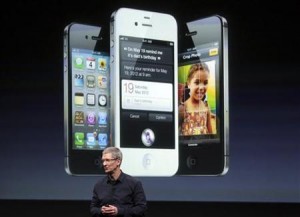 Apple CEO Tim Cook speaks in front of an image of an iPhone 4S at Apple headquarters in Cupertino, California October 4, 2011.