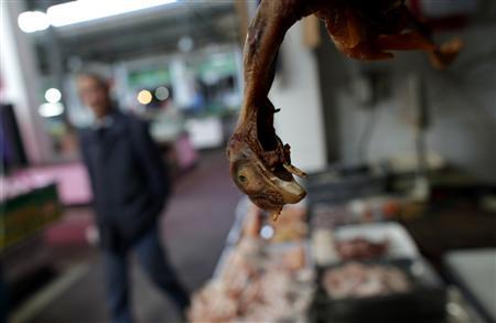 Chicken is seen at a local market in Minhang district, south of Shanghai