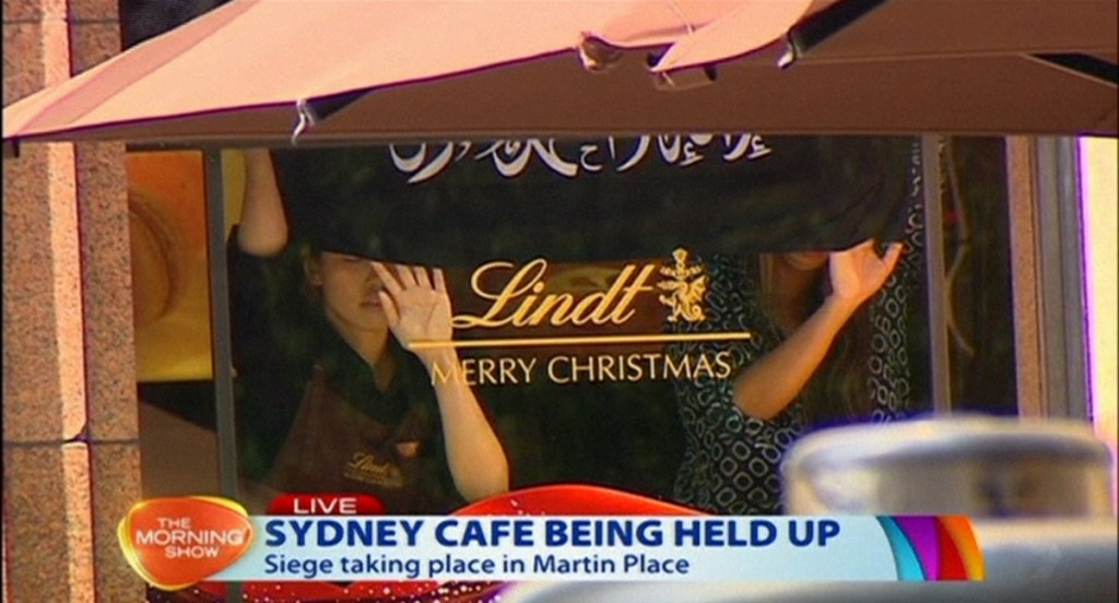 Hostages Forced To Hold 'Arabic Flag' In Cafe Window